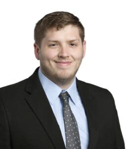 Portrait of Colby Duffendack in formal business attire.
