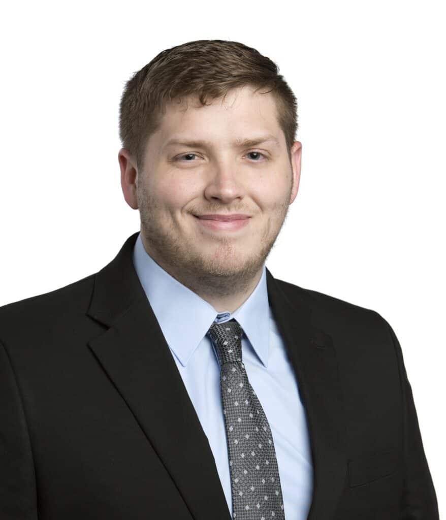 Portrait of Colby Duffendack in formal business attire.