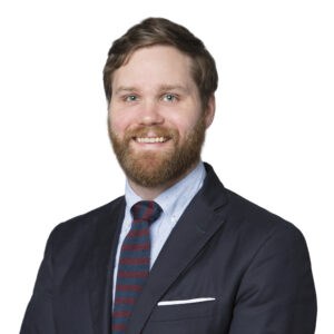 Portrait of Matthew Heckmann in business attire for Corridor Title.
