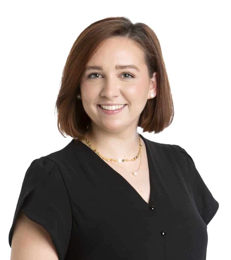 Portrait of Meghan Hunter smiling in a black top.