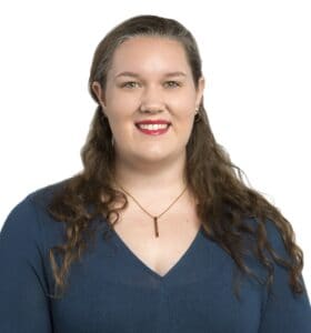 Rhianna Hoffmann smiling in a professional headshot.