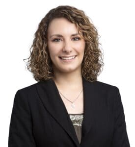 Morgan Foster in professional attire for business profile.