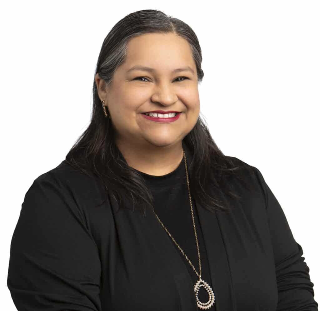 Anna Ramirez smiling in a professional portrait for Corridor Title.